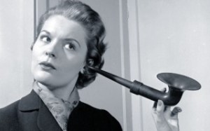 young-woman-holding-ear-trumpet-black-and-whit_450-320x200